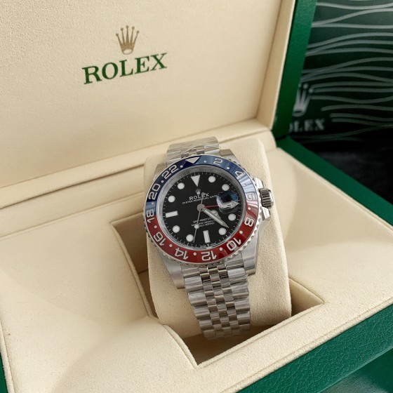 Rolex GMT-Master series, black dial, red and blue bezel, 40mm, silver five-link bracelet.