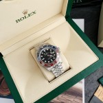 Rolex GMT-Master series, black dial, red and blue bezel, 40mm, silver five-link bracelet.