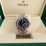 Rolex GMT-Master series, black dial, red and blue bezel, 40mm, silver five-link bracelet.