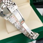 Rolex GMT-Master series, black dial, red and blue bezel, 40mm, silver five-link bracelet.
