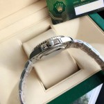 Rolex Submariner, blue dial, blue bezel, 40mm, silver Oyster bracelet.