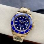 Rolex Submariner, blue dial, blue bezel, 40mm, gold Oyster bracelet.