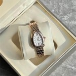 Bulgari snake watch with white dial and gold strap