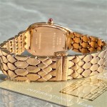 Bulgari snake watch with white dial and gold strap