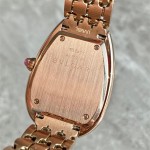 Bulgari snake watch with white dial and gold strap