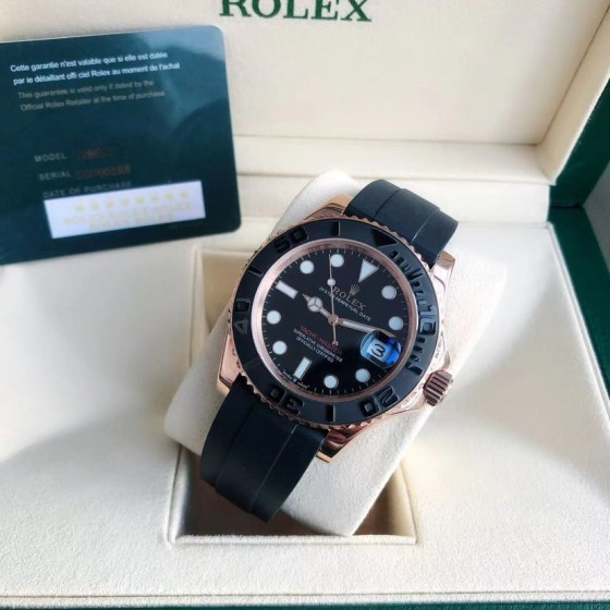 Rolex Yacht-Master series, black dial, black bezel, rose gold case, 40mm, rubber strap.
