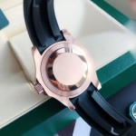 Rolex Yacht-Master series, black dial, black bezel, rose gold case, 40mm, rubber strap.