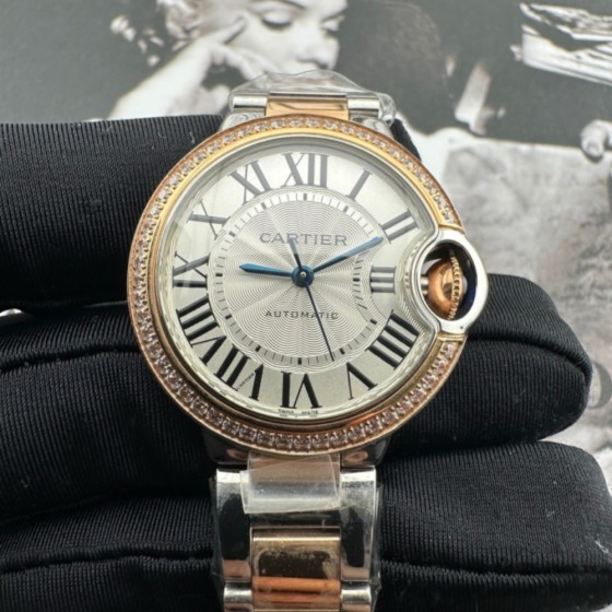 Cartier Ballon Bleu, 33mm, silver dial with diamond-set bezel, two-tone gold and silver.