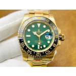 Rolex GMT-Master series, green dial, black bezel, 40mm, gold Oyster bracelet.