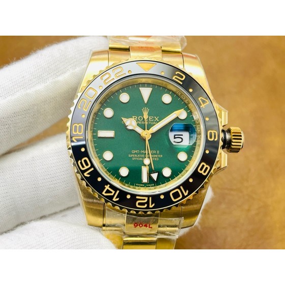 Rolex GMT-Master series, green dial, black bezel, 40mm, gold Oyster bracelet.