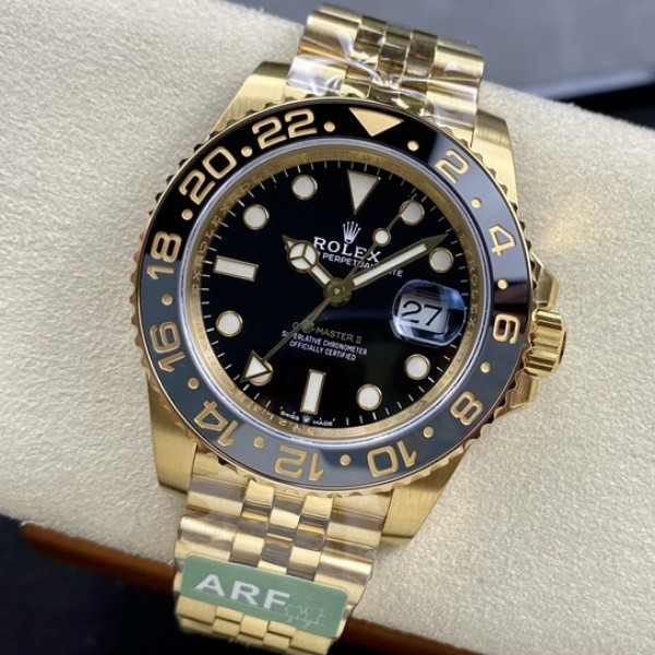 Rolex GMT-Master series, black dial, black bezel, 40mm, gold five-link bracelet.