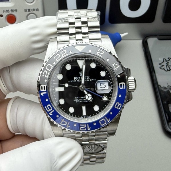 Rolex GMT-Master series, black dial, black and blue bezel, 40mm, silver five-link bracelet.