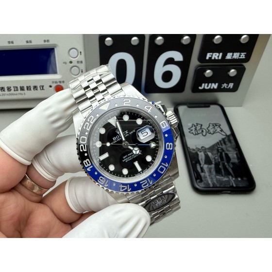 Rolex GMT-Master series, black dial, black and blue bezel, 40mm, silver five-link bracelet.