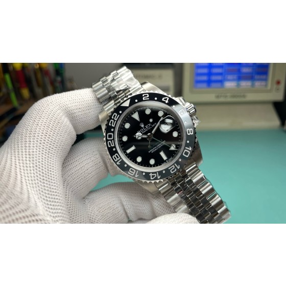 Rolex GMT-Master series, black dial, black bezel, 40mm, silver five-link bracelet.
