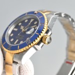 Greenwich series, blue dial, blue bezel, 40 mm, silver and gold Oyster bracelet.