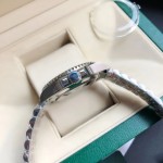 Greenwich series, meteorite-colored dial, blue and red bezel, 40mm, silver five-link bracelet.