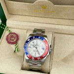 Greenwich series watch with meteorite-patterned dial, blue and red bezel, 40mm, and silver Oyster bracelet.