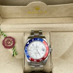 Greenwich series watch with meteorite-patterned dial, blue and red bezel, 40mm, and silver Oyster bracelet.