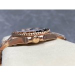 Greenwich series watch with tiger's eye dial, black and red bezel, 40mm case, and rose gold Oyster bracelet.