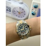 Greenwich series, black dial, black bezel, 40mm, gold and silver five-link bracelet.