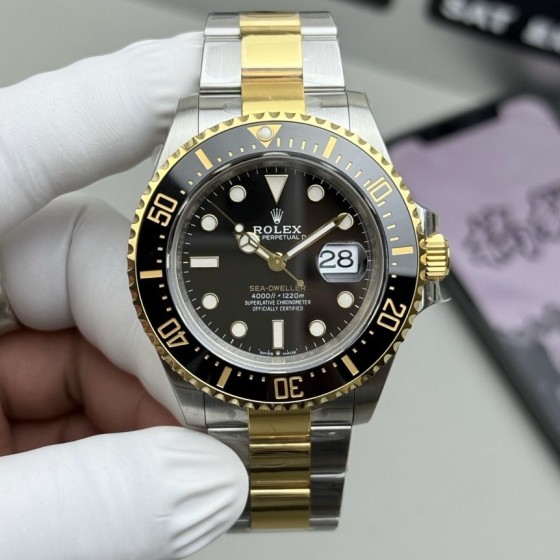 Rolex Sea-Dweller series, black dial, 43mm, silver and gold Oyster bracelet.