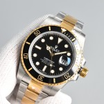 Rolex Submariner series, black dial, black bezel, 40mm, silver and gold Oyster bracelet.