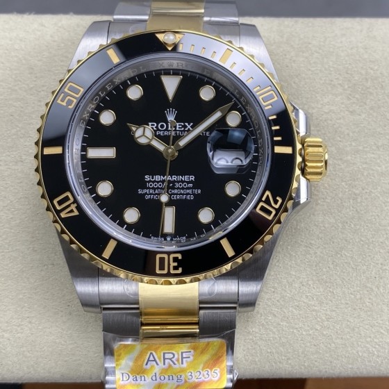 Rolex Submariner series, black dial, black bezel, 41mm, silver and gold Oyster bracelet.