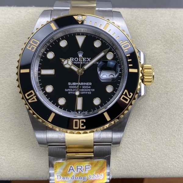Rolex Submariner series, black dial, black bezel, 41mm, silver and gold Oyster bracelet.