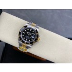 Rolex Submariner series, black dial, black bezel, 41mm, silver and gold Oyster bracelet.