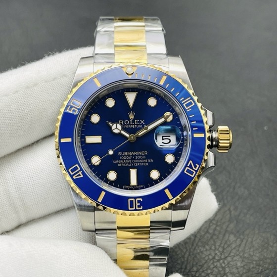 Rolex Submariner series, blue dial, blue bezel, 40mm, silver and gold Oyster bracelet.