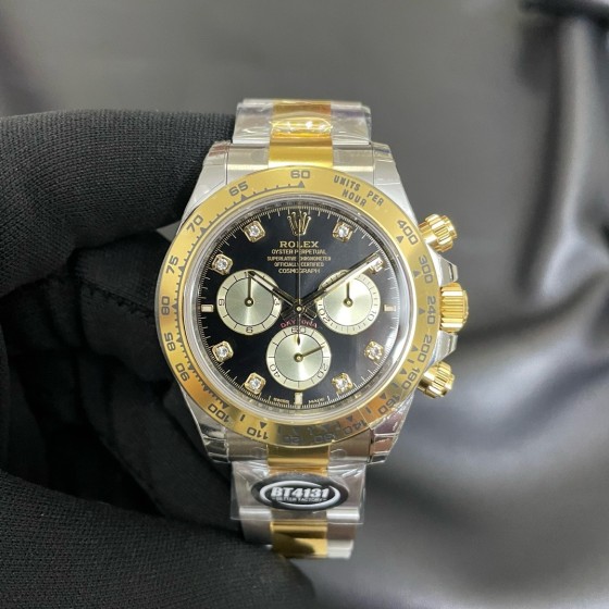 Rolex Daytona series, diamond-set black dial, gold bezel, silver case, 40mm, gold and silver Oyster bracelet.