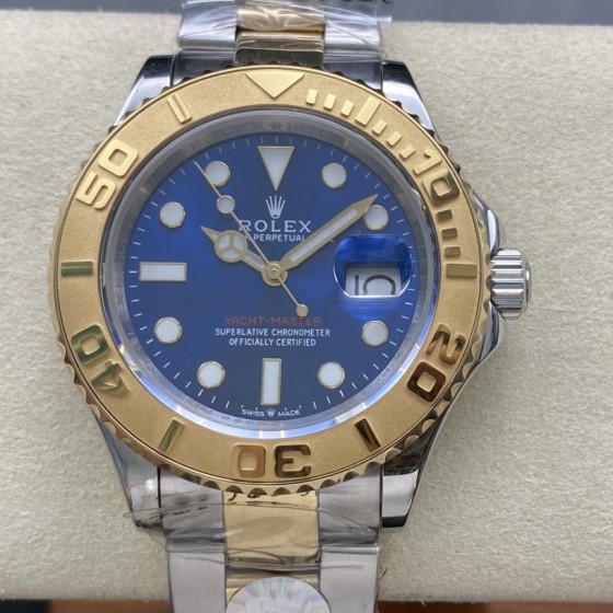 Rolex Yacht-Master series, blue dial, gold bezel, silver case, 44mm, two-tone Oyster bracelet.