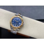Rolex Yacht-Master series, blue dial, gold bezel, silver case, 44mm, two-tone Oyster bracelet.