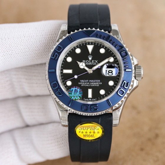 Rolex Yacht-Master series, black dial, blue bezel, silver case, 40mm, rubber strap.