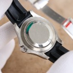 Rolex Yacht-Master series, black dial, blue bezel, silver case, 40mm, rubber strap.