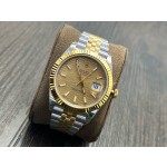 Datejust series men's and women's watches with wave pattern gold dial, gold bezel, 36mm and 41mm sizes, and two-tone five-link bracelet.