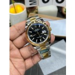 Datejust series men's watch, black dial, gold bezel, 41mm, two-tone Oyster bracelet.