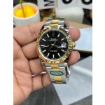 Datejust series men's watch, black dial, gold bezel, 41mm, two-tone Oyster bracelet.
