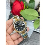 Datejust series men's watch, black dial, gold bezel, 41mm, two-tone Oyster bracelet.