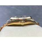 Navigator series men's watch, green dial, gold bezel, 42mm, gold five-link bracelet.