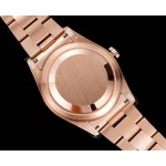 Navigator series men's watch, blue-green dial, rose gold bezel, 42mm, rose gold Oyster bracelet.