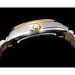 Navigator series men's watch, black dial, gold bezel, 42mm, two-tone five-link bracelet.