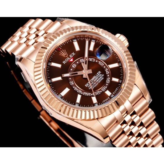Navigator series men's watch with chocolate dial, rose gold bezel, 42mm case, and rose gold five-link bracelet.