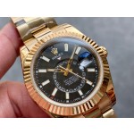 Navigator series men's watch with bright black dial, gold bezel, 42mm case, and gold Oyster bracelet.