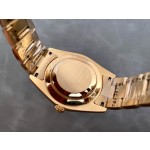 Navigator series men's watch with bright black dial, gold bezel, 42mm case, and gold Oyster bracelet.