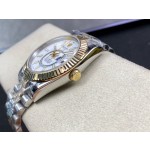 Navigator series men's watch, white dial, gold bezel, 42mm, two-tone five-link bracelet.