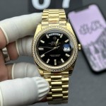 Sunday calendar series men's watch with black ice candy-colored dial, diamond-set bezel, and 40mm gold President-style bracelet.