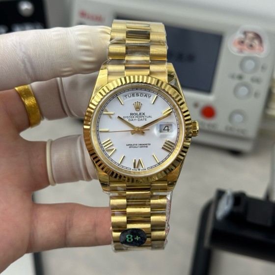 Sunday Calendar series men's and women's watches, white dial, gold bezel, 36mm and 40mm sizes, gold President-style bracelet.