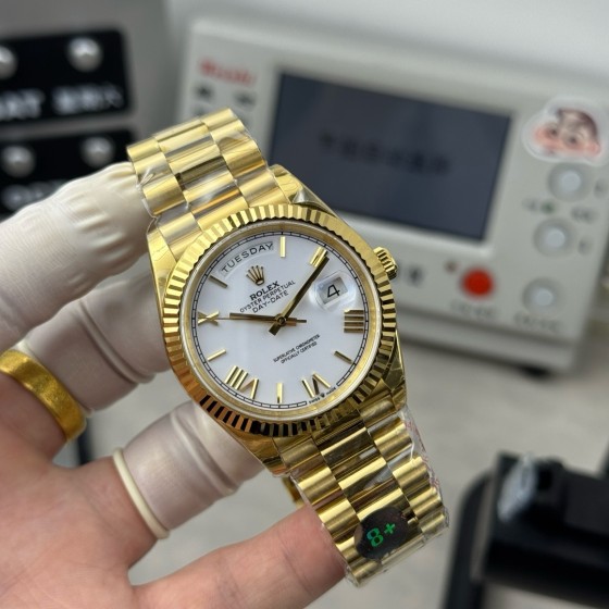 Sunday Calendar series men's and women's watches, white dial, gold bezel, 36mm and 40mm sizes, gold President-style bracelet.