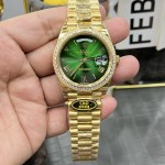 Sunday calendar series men's watch with gradient green dial, diamond-set bezel, and 40mm gold President-style bracelet.